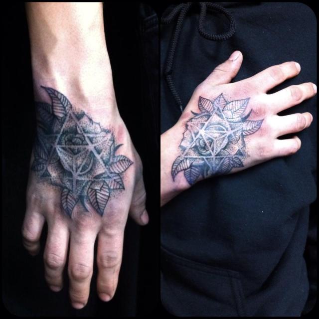 Dot work, shapes & patterns hand tattoo.   Golden Iron Tattoo Studio is located on 363 Spadina Ave Toronto ON, M5T 2G3. For inquires on booking an appointment please contact (416)-903-1624 during opening hours 11:00AM-7:00PM 