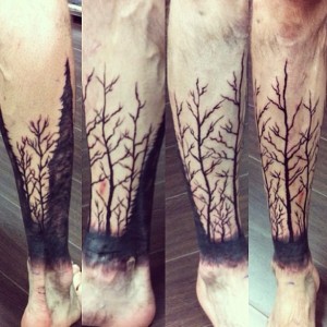 Solid Black Tree Branch half leg Tattoo.  Golden Iron Tattoo Studio is located on 363 Spadina Ave Toronto ON, M5T 2G3. For inquires on booking an appointment please contact (416)-903-1624 during opening hours 11:00AM-7:00PM