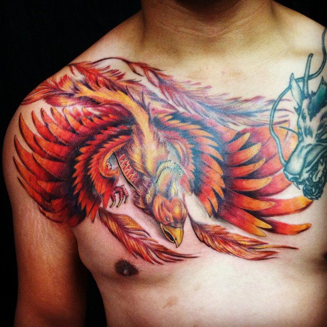 Color work Phoenix chest tattoo.  Golden Iron Tattoo Studio is located on 363 Spadina Ave Toronto ON, M5T 2G3. For inquires on booking an appointment please contact (416)-903-1624