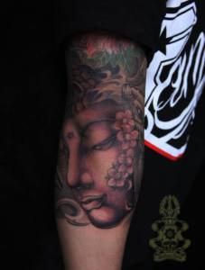 Black & Grey Buddha tattoo.  Golden Iron Tattoo Studio is located on 363 Spadina Ave Toronto ON, M5T 2G3. For inquires on booking an appointment please contact (416)-903-1624 during opening hours 11:00AM-7:00PM 