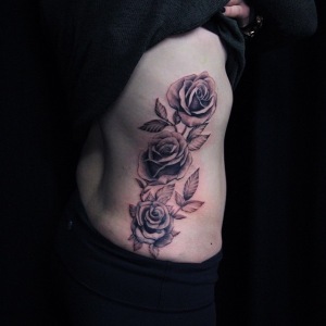 Black and grey rose rib tattoo by Cysen. Golden Iron Tattoo Studio is located on 363 Spadina Ave Toronto ON, M5T 2G3. For inquires or to book an appointment please contact (416)-903-1624 during opening hours 11:00AM-8:00PM